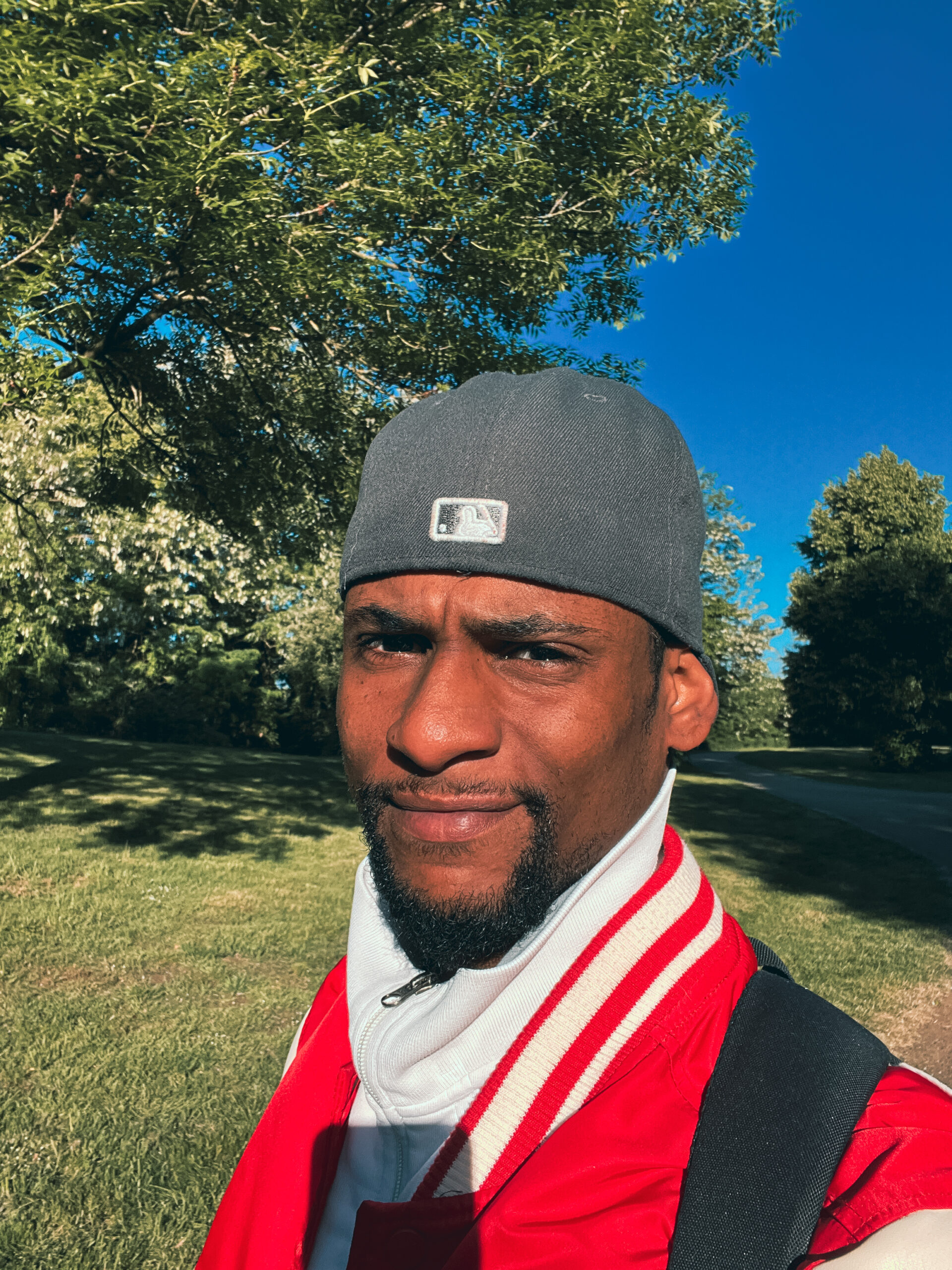IMG_6739 Selfie from A guy with a cap backwards, and a red college jacket